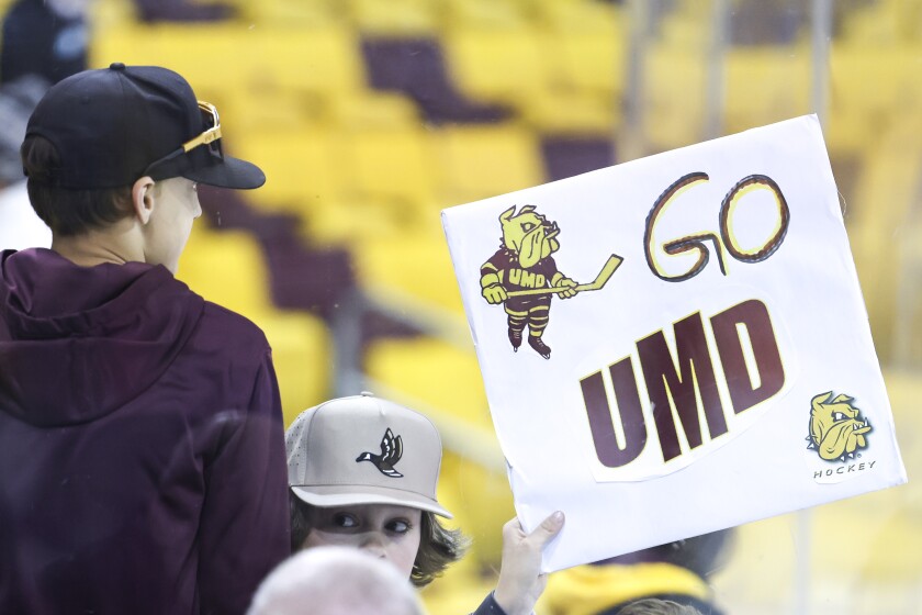 college men play ice hockey
