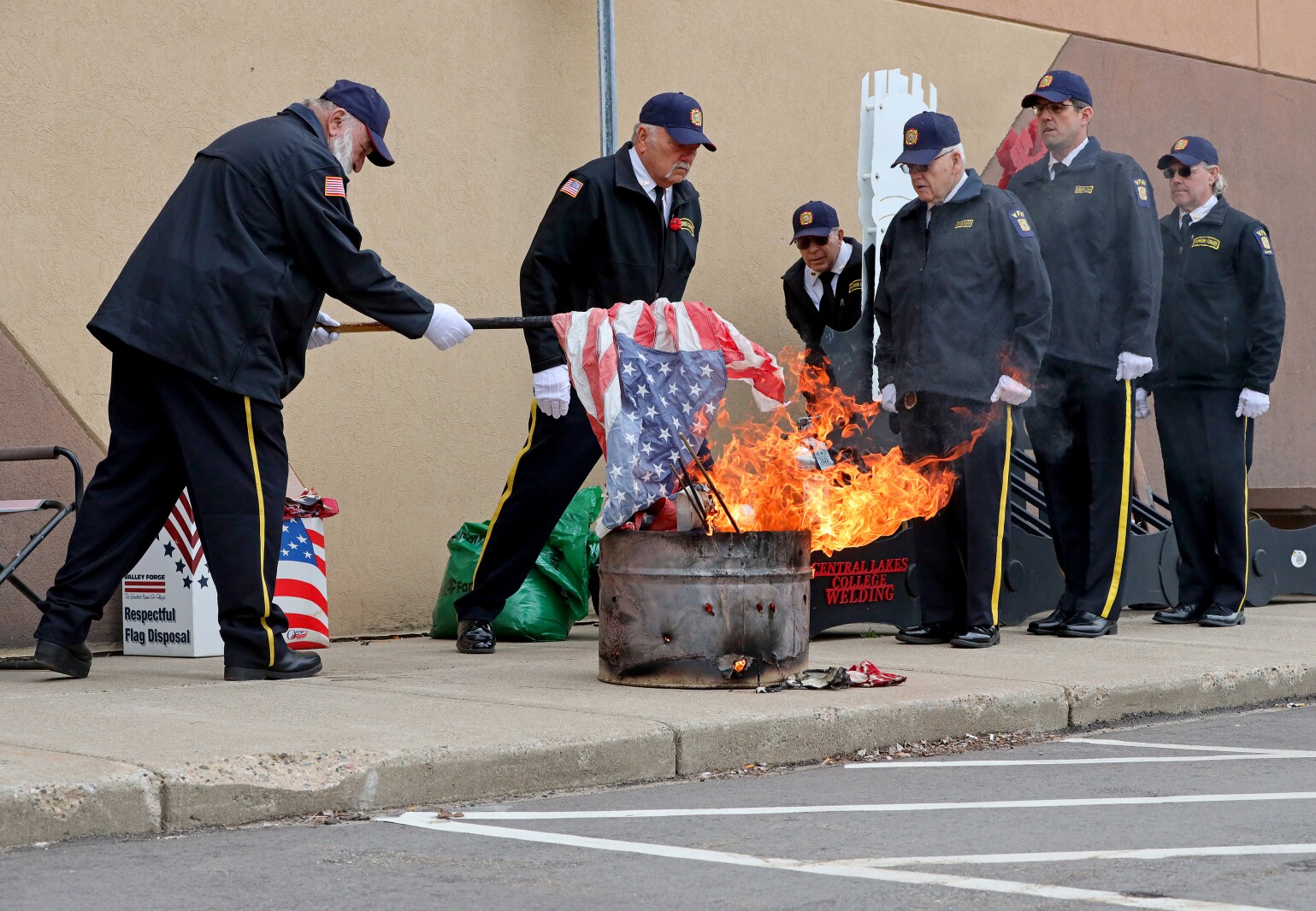 Retiring the flag with grace and dignity, the Brainerd Honor Guard performs a flag ceremony that involves burning old and damaged flags in a respectful manner.