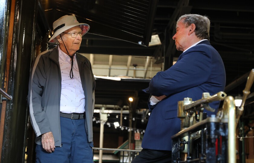 Ted Yablonski, left, chats with Lake Superior Railroad Museum Foundation Executive Director, Ken Buehler,