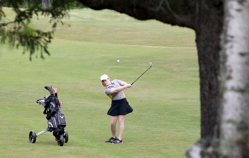 Northwestern's Reese Smith chips onto the green on the second hole of the East Course at Nemadji Golf Course.