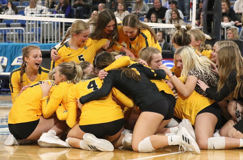 b volleyball state champ game n cass team hug celebrate 111922.jpg