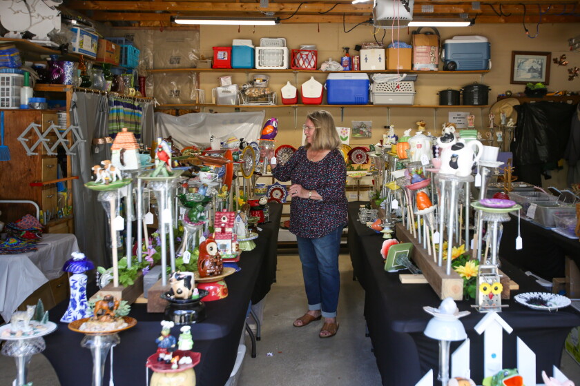 Marlene Olson's garage in south Fargo is filled with glassware art she makes and sells through her business, Garden Art & More. 'I don't do it for money,' Olson said. 'It's my hobby, my therapy, my fun.'