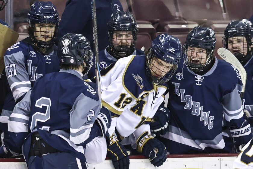 high school boys play ice hockey