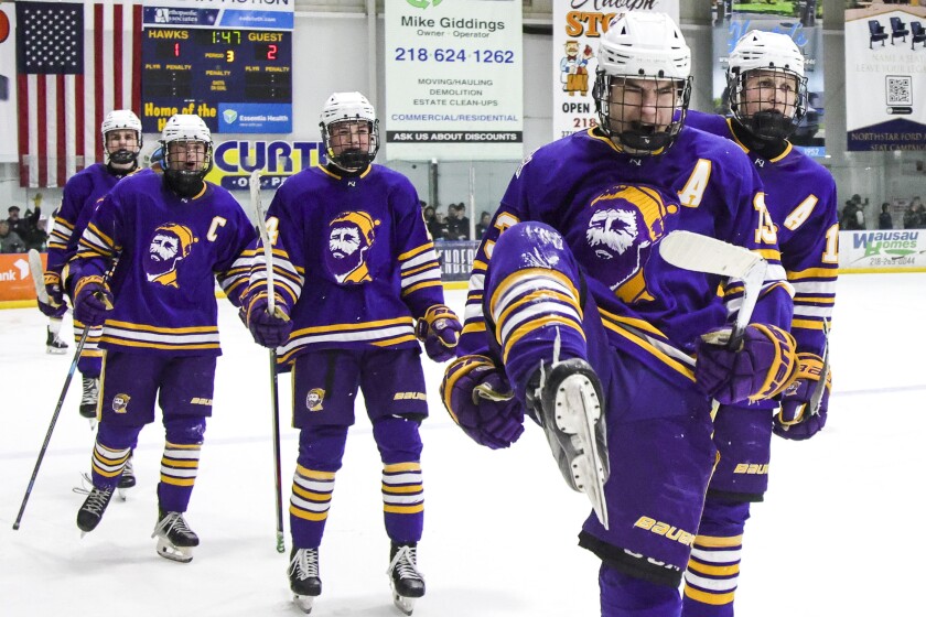 high school boys play ice hockey