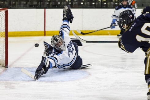high school boys play ice hockey