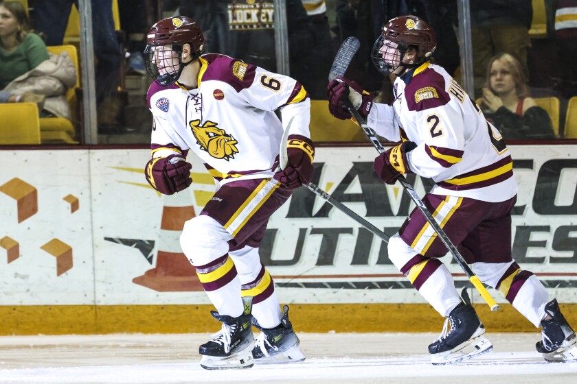 college men play ice hockey