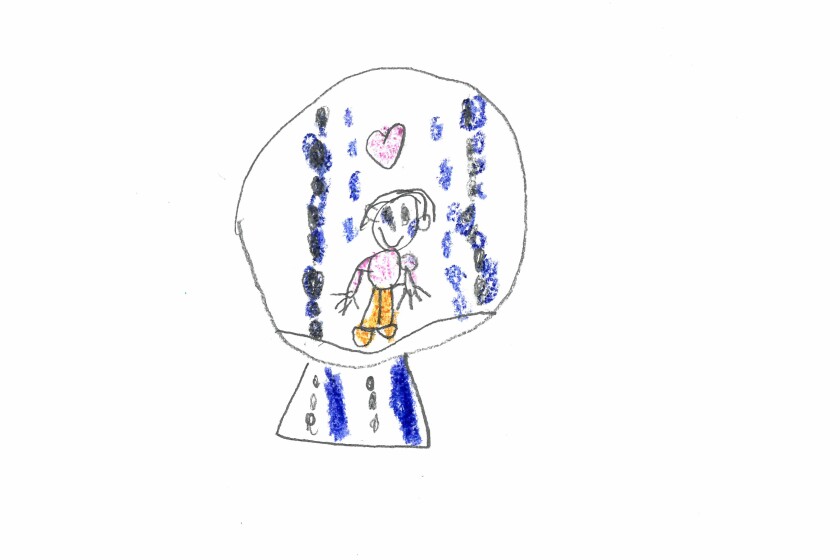 A boy in a snow globe.