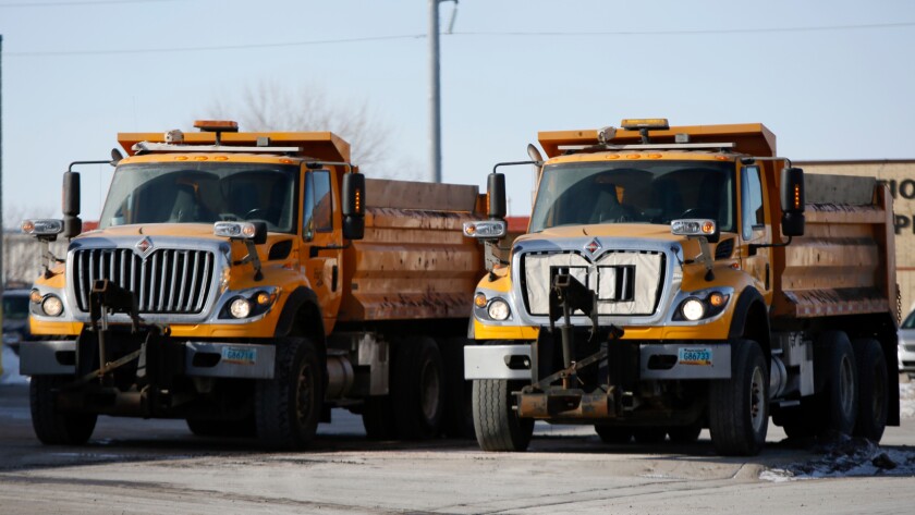 Two sand trucks prepare Thursday, Feb. 1, 2018, to leave the City of Fargo Central Garage. Michael Vosburg / Forum Photo Editor