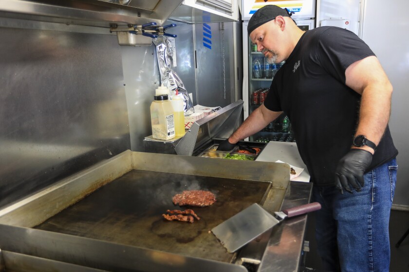 Chef preparing hamburgers
