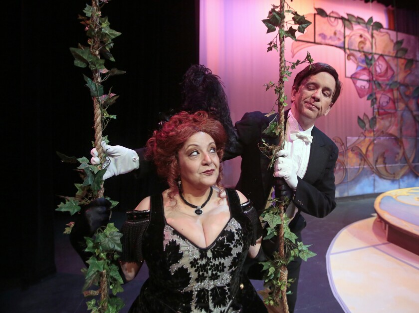 Stella Zambalis and David Hamilton rehearse a scene from the Fargo-Moorhead Opera's 2013 production of "The Merry Widow." Forum file photo