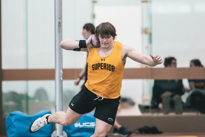 Track athlete prepares to throw the shot put
