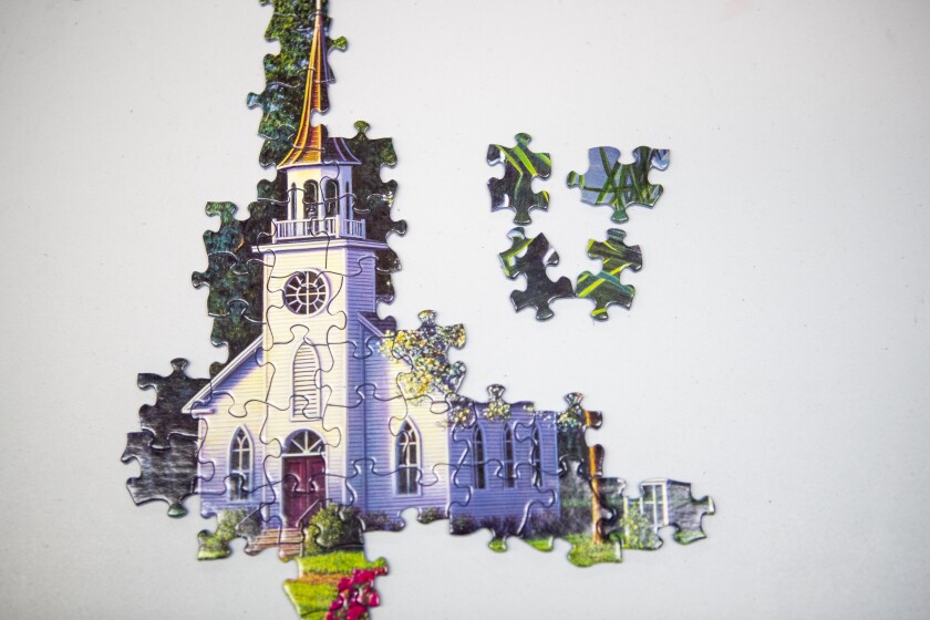 An unfinished puzzle sits on a table at the GlenOaks Senior Living Campus in New London on Tuesday, March 29, 2022.