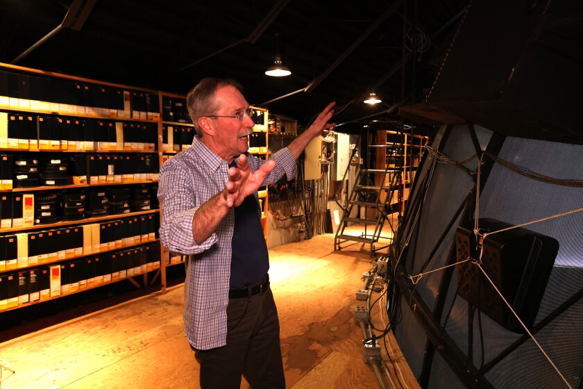 Man shows off area behind space theatre dome