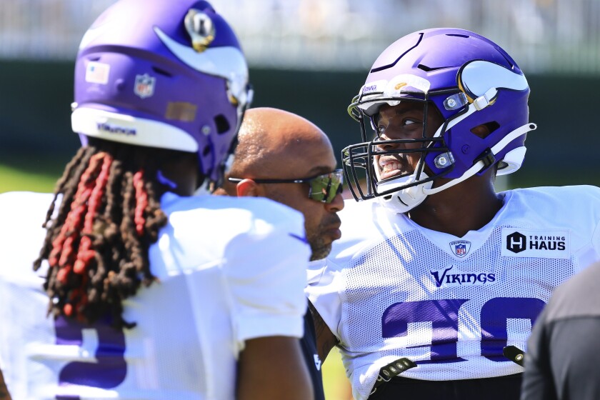Professional football players practice at outdoor field