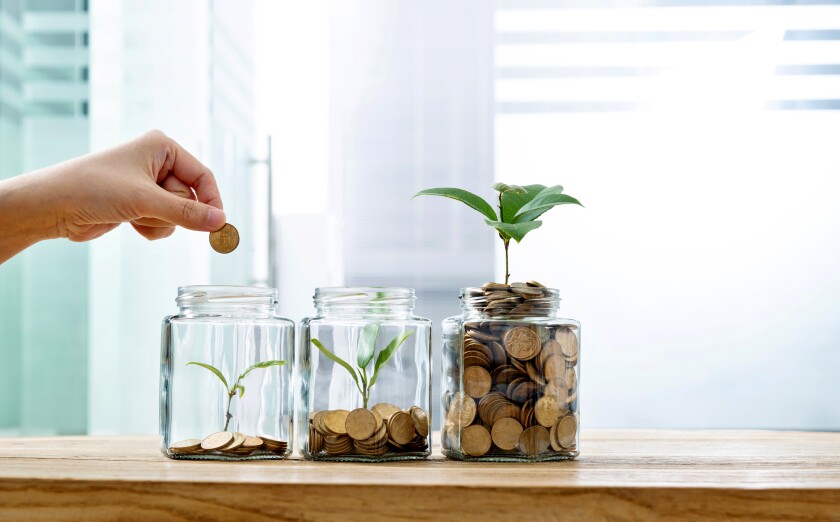 The pennies are in three staggered glass jars for small, medium and large