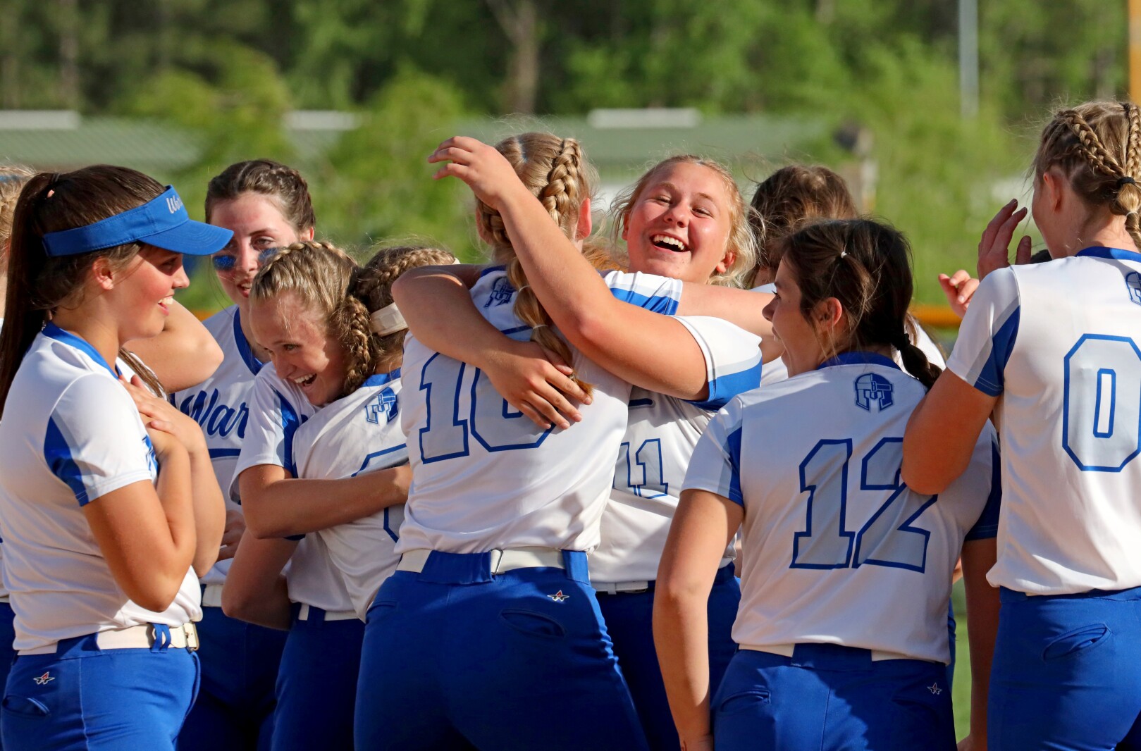 Brainerd softball team celebrating their win.