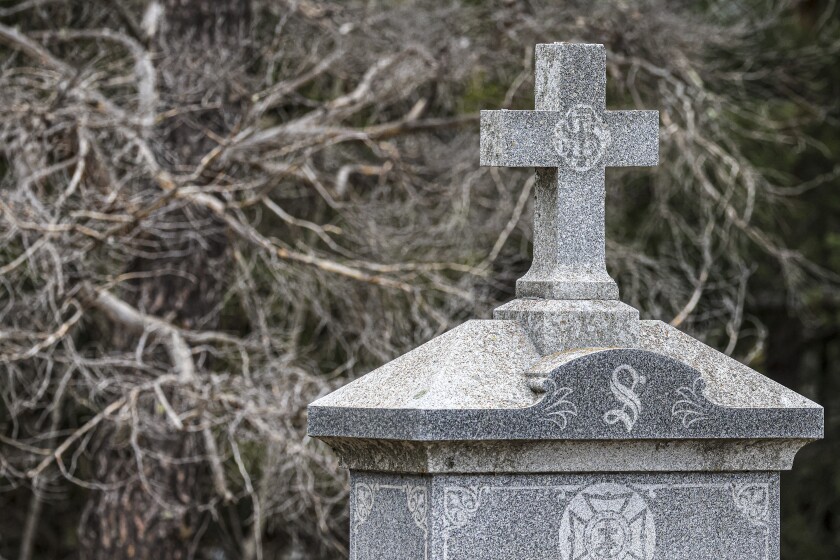 woman documents gravestones