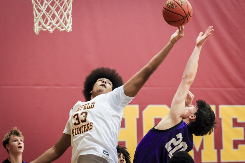 high school boys play basketball