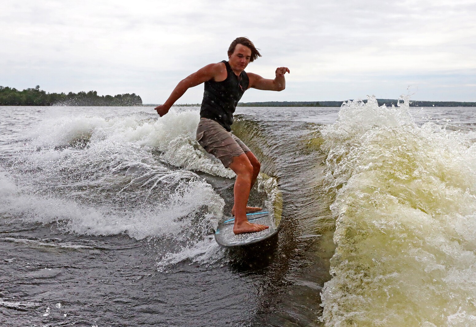 Parker Linn demonstrates wake surfing for people during the ninth annual Bar Harbor In-Water Boat Show on Saturday, June 18, 2022, on Gull Lake. Watercraft for the boat show were brought by Nisswa Marine and Minnesota Inboard Water Sports and a Wake Responsibly event taught attendees boat safety and responsibility.