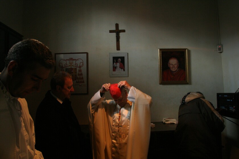 Theodore McCarrick prepares to celebrate Mass