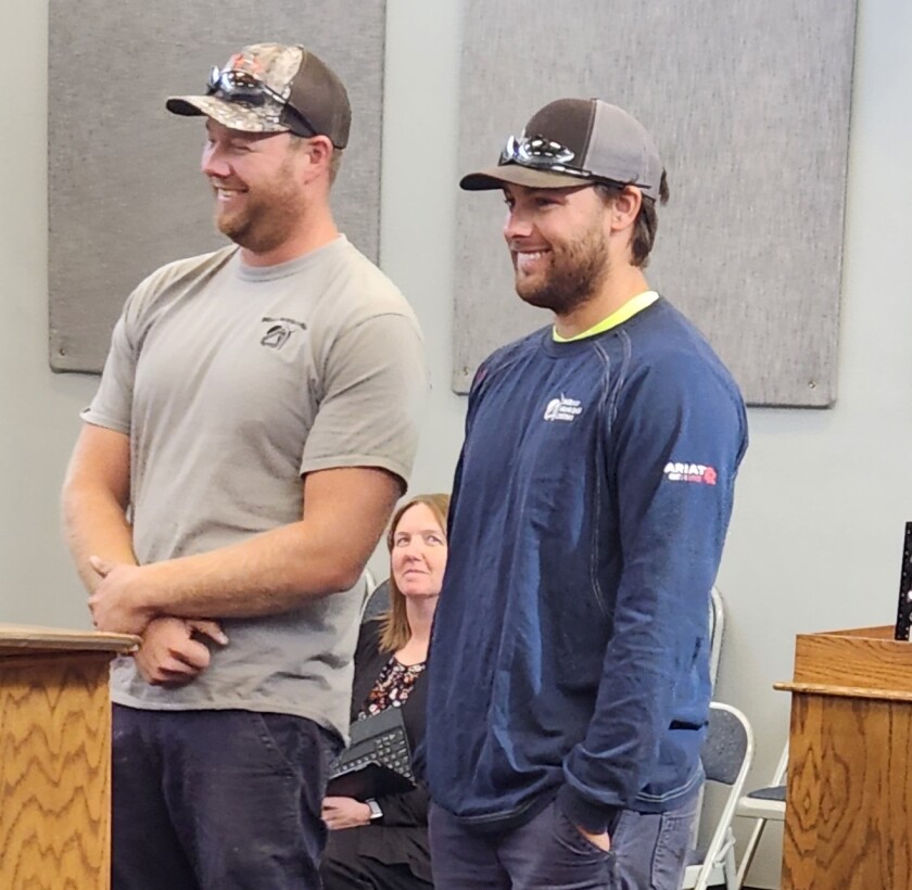 Willmar Municipal Utilities lineman Joe Johnson, from left, and Ryan Kobliska answered the call to go to Florida to help with power restoration efforts after Hurricane Ian.