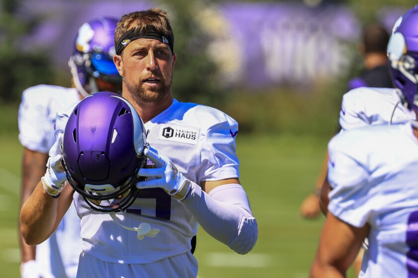 Professional football players practice at outdoor field