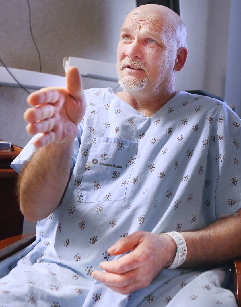 From his hospital room at Essentia Health, Mark Anderson of Duluth recounts how he braced himself against the steering wheel as his truck went through the guard rail and plunged off the Blatnik Bridge. Bob King / rking@duluthnews.com
