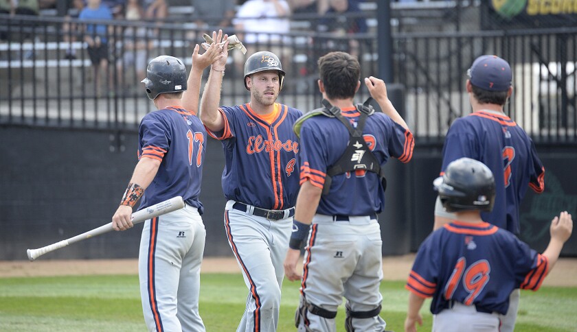 The Elrosa Saints' Kevin Kuefler, 4, is greeted at the dugout after scoring a run in the fifth inning of a Class C state amateur baseball playoff game against the Montgomery Mallards on Saturday, Aug. 20, 2022 at Bell Field in Faribault.