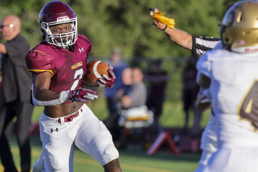 Football player playing in outdoor stadium