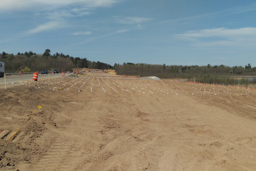 Flags mark the spots where vertical wick drains will be installed at Cullen Brook in Nisswa. A working platform has been constructed for the wick drain placement and surcharge activities at Cullen Brook. Submitted Photo