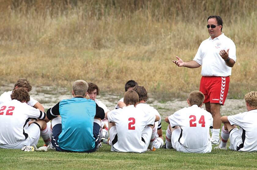 Coach Justin Wegleitner with team