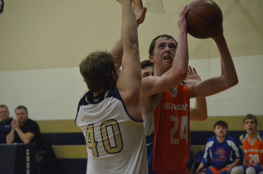 Glen Ullin-Hebron junior forward Braxton Rolle looks to score inside against Heart River on Feb. 27 from South Heart High School. (Patrick Bernadeau/The Dickinson Press)