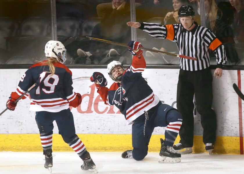 Bismarck players celebrate their state championship Saturday at the Ralph Engelstad Arena. photo by Eric Hylden/Grand Forks Herald