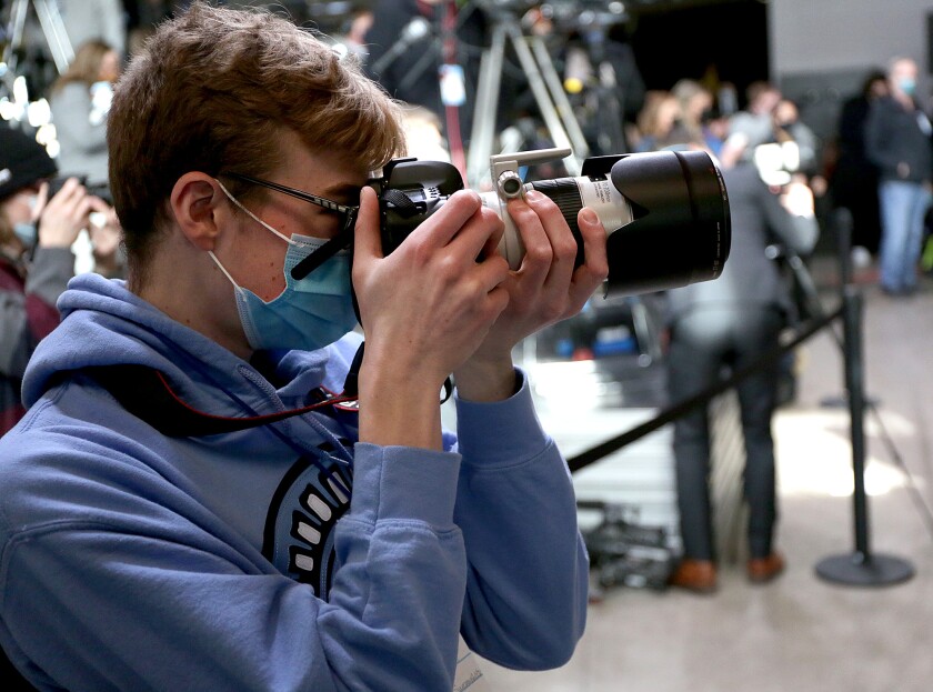 Dale Summerfield Jr., the co-editor-in-chief of the Spartan Spin, Superior High School’s student newspaper, takes photos of President Joe Biden