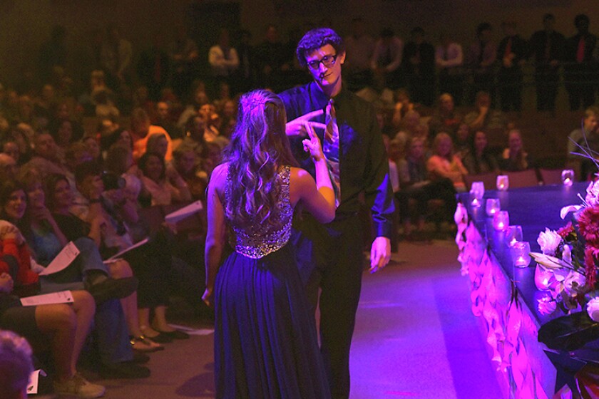 Briana Sanchez / TribuneKayla Rudie and Jacob Minnick do a handshake before going on stage during coronation. Minnick was Rudie's escort.