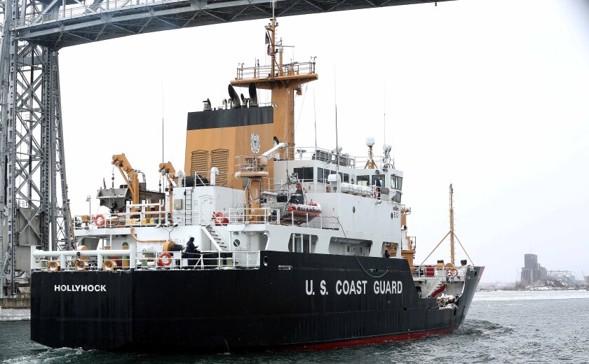 The ship passes under the lift bridge