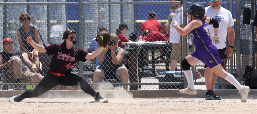 Edgerton /Southwest Minnesota Christian Flying Dutchmen first baseman Katheryn Prins (44) catches the throw to first to get the out on Red Lake Falls Eagles Quinnlyn Kenfield during state Class A softball Thursday in North Mankato Caswell Park.
