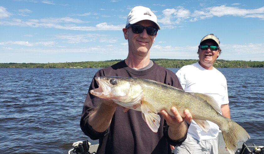 Ron Nies and GM with 24-inch walleye.jpg