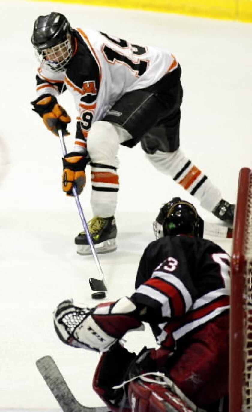 Jeff Foss pushes against Mike Renier