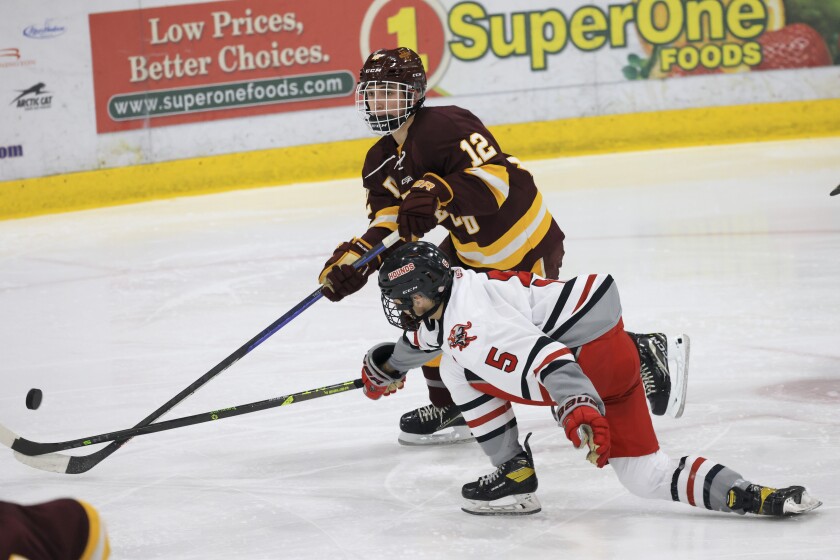high school boys play ice hockey