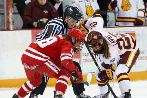 Hockey players take a faceoff