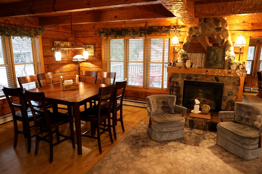 A table that sits eight is located just off of the kitchen in the Farmhouse