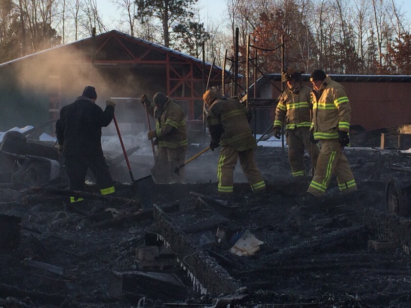 Minnesota State Fire Marshal Mark Germain (left) and Nisswa firefighters investigate the debris left over from a structure fire Tuesday morning at Boberg Lumber in Nisswa. The building, which houses a beauty shop, was destroyed.Jennifer Stockinger / Brainerd Dispatch
