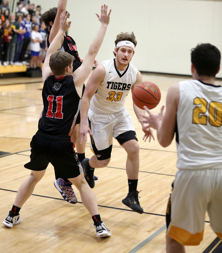 Northwestern’s CJ Thompson (33) dumps the ball off to a wide open Mason Dupree (20) past Somerset’s Jack Casey (11)