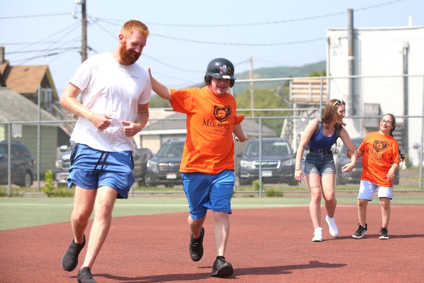 People running the bases during a baseball game.