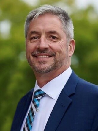Professional portrait of Jim Sieben, president of Nova-Tech Engineering and the MinnWest Technology Campus in Willmar