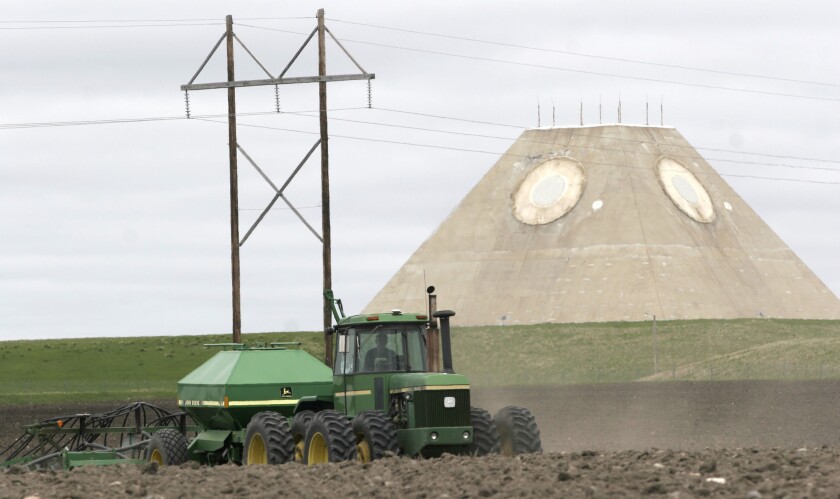 A farmer wheat near a defunct Cold War missile site in Nekoma, N.D.