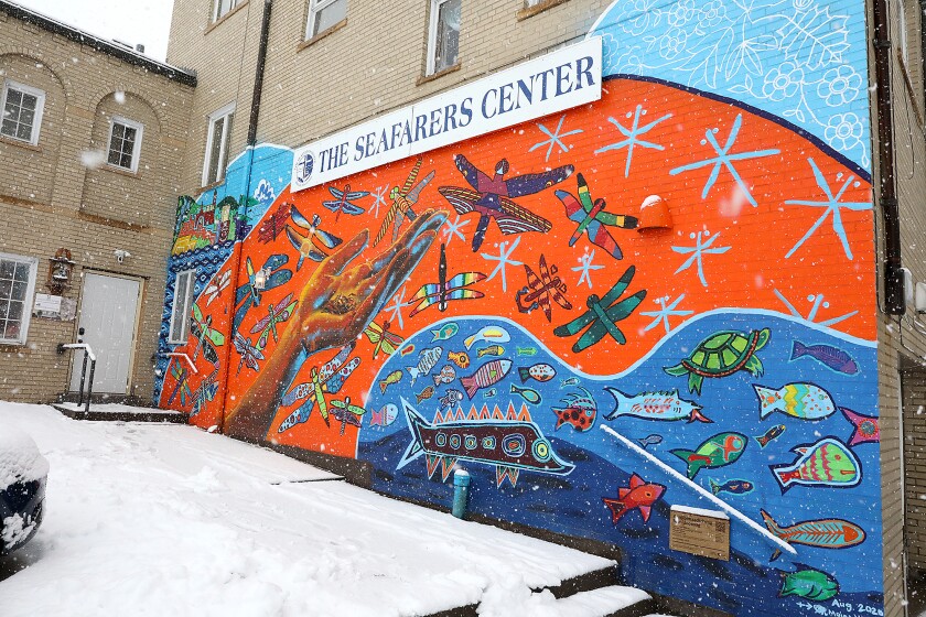 A mural titled Aanjibimaadiziwag Manidoonsag by Moira (Miri) Villiard, Michelle Waabanangagokwe Defoe, Heather Olson and Aurora Webster can be seen on the wall at the Seafarers Center as snow falls Wednesday morning