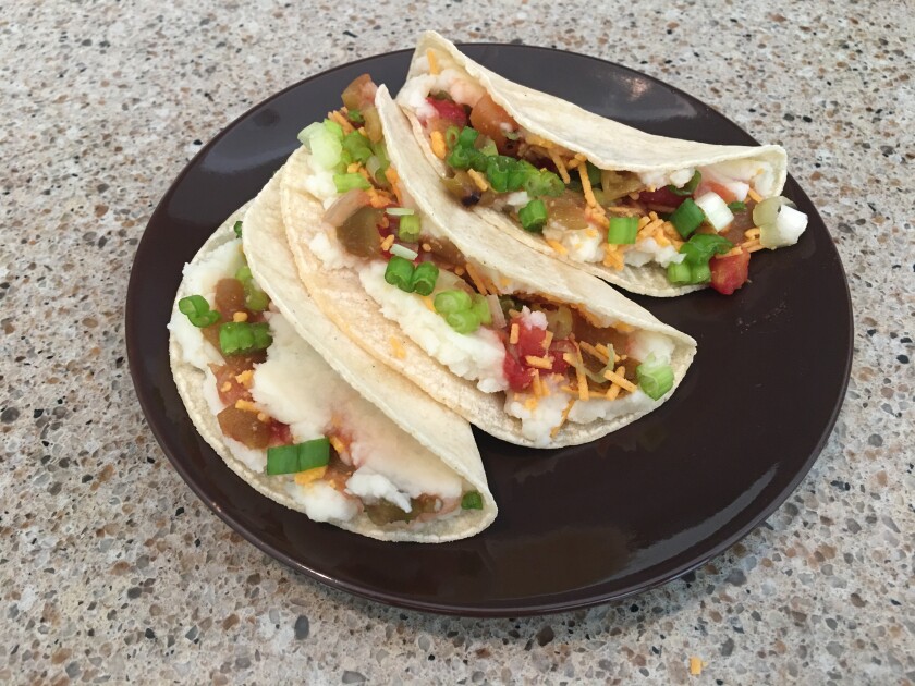 Plate of three vegan mashed potato tacos