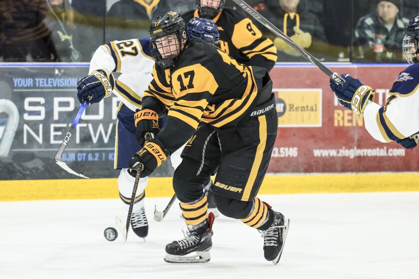 high school boys play ice hockey